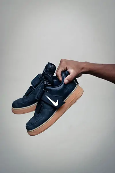 Holding branded trainers - TikTok business profile content