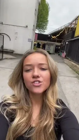 Creator filming a selfie video on a city street
