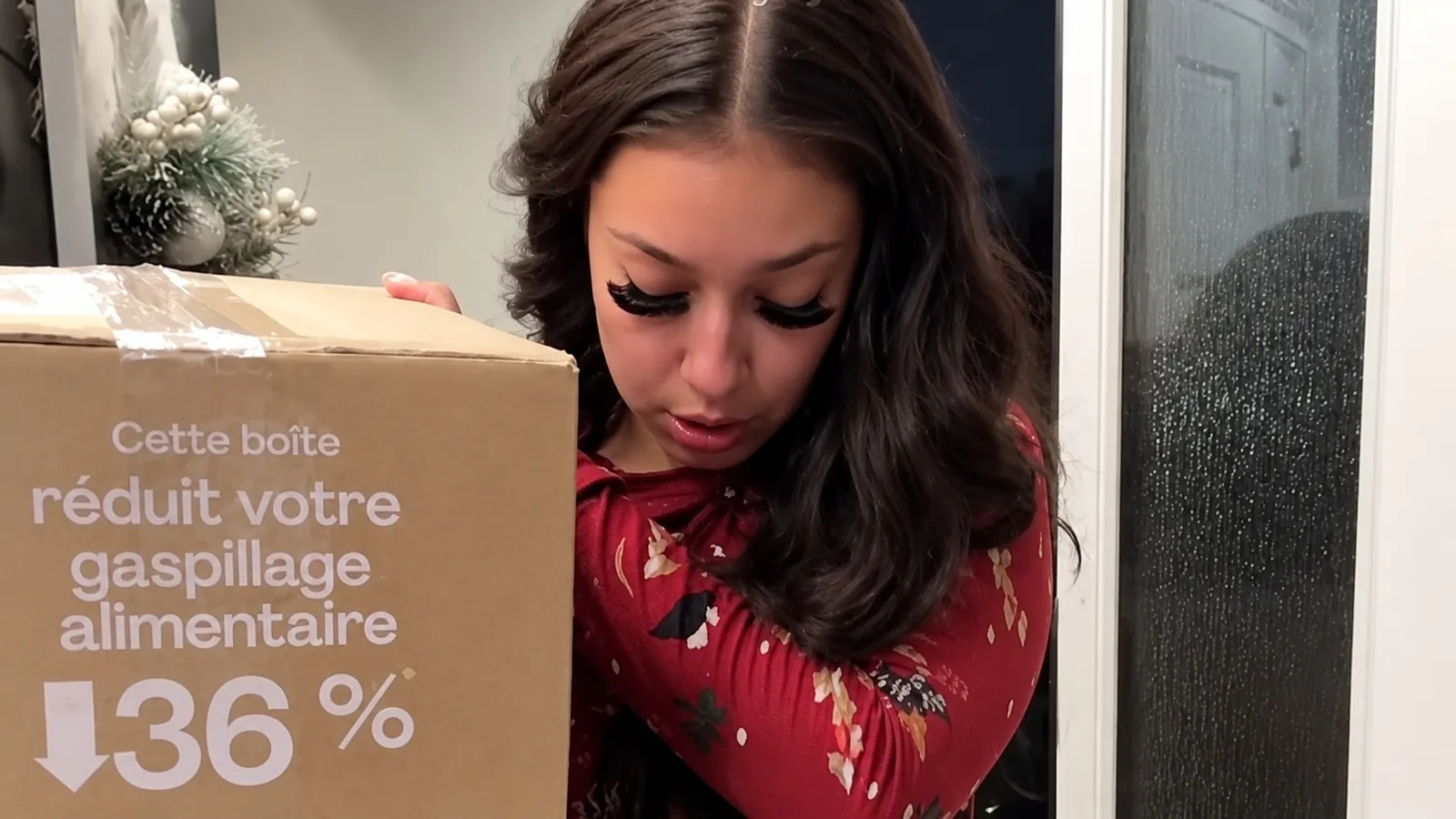 Creator opening a meal kit delivery box at home