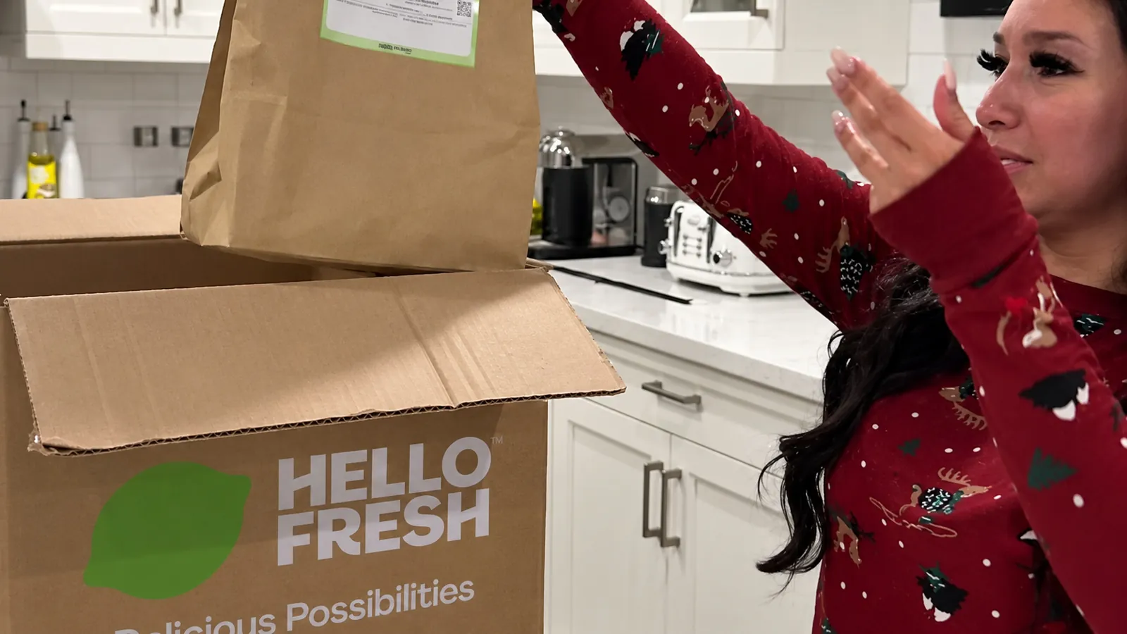 Creator unpacking a meal kit in her kitchen